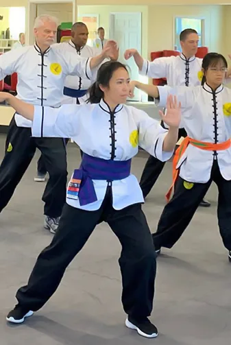 Adult students practicing a Tien Shan Pai form